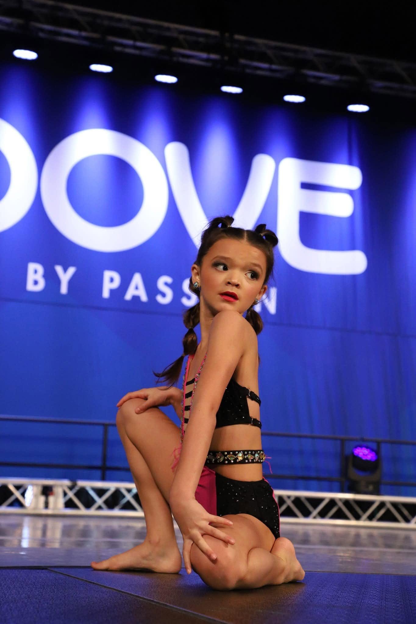 DKG competition dancer with stage hairstyle