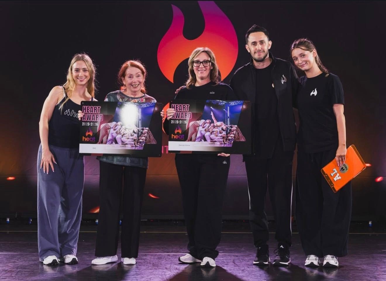 DKG dancers receiving a competition award