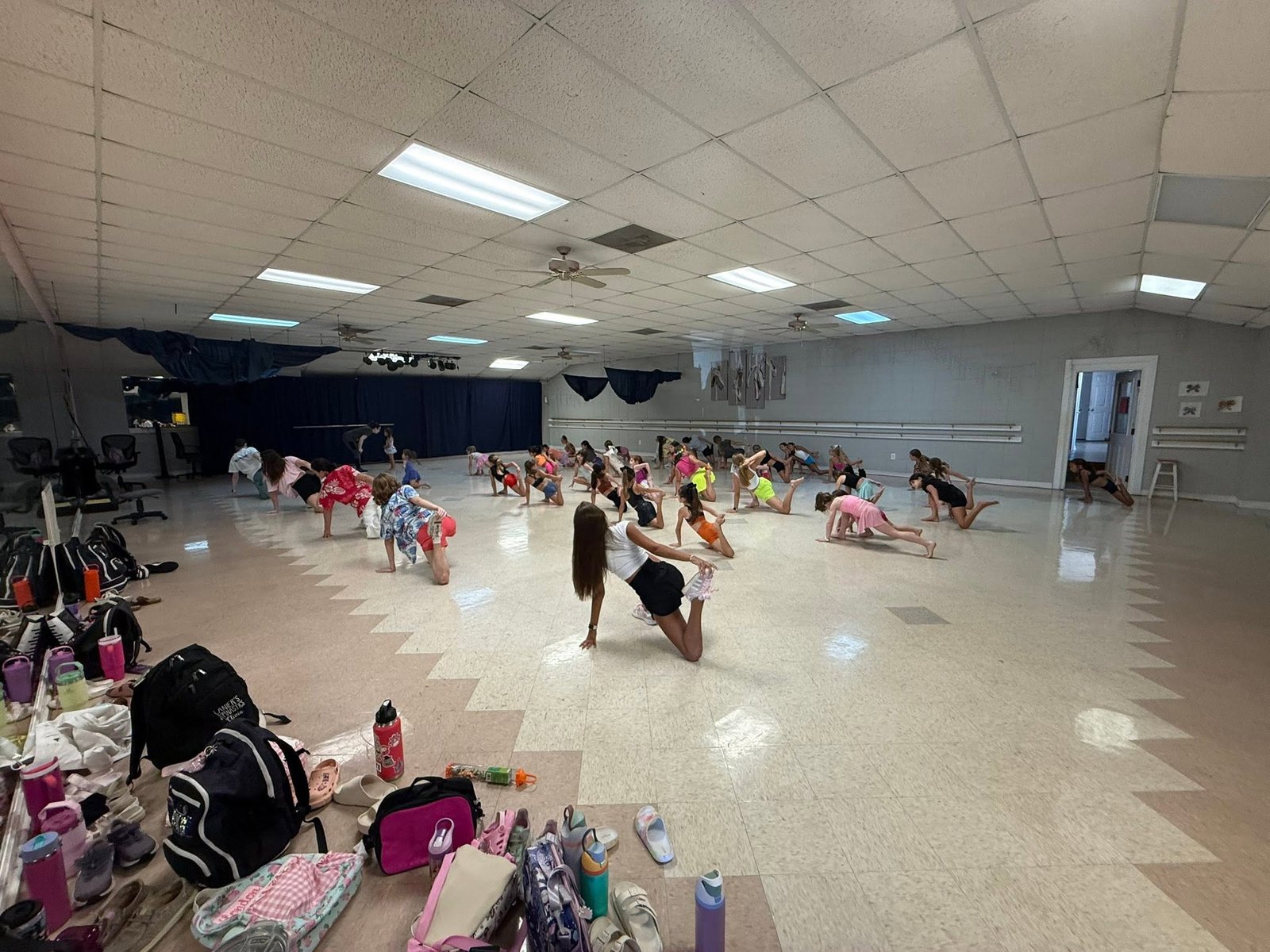 Dance students practicing stretches